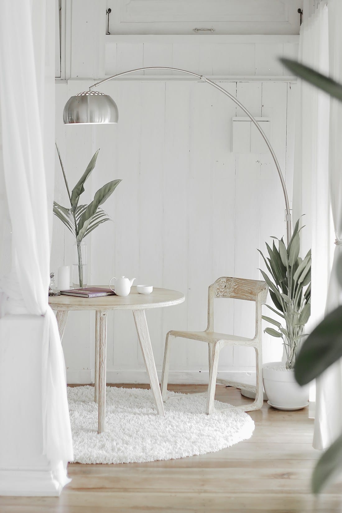 Two armchairs in a quiet, sunlit interior — the room where the work happens